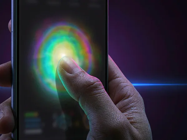 m444 Finger touches a glowing circle on a phone screen